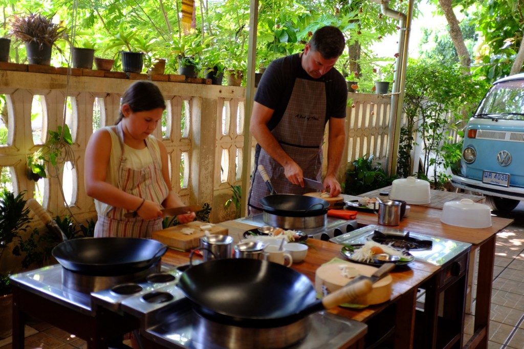 Father and daughter cooking together at a Balinese cooking class