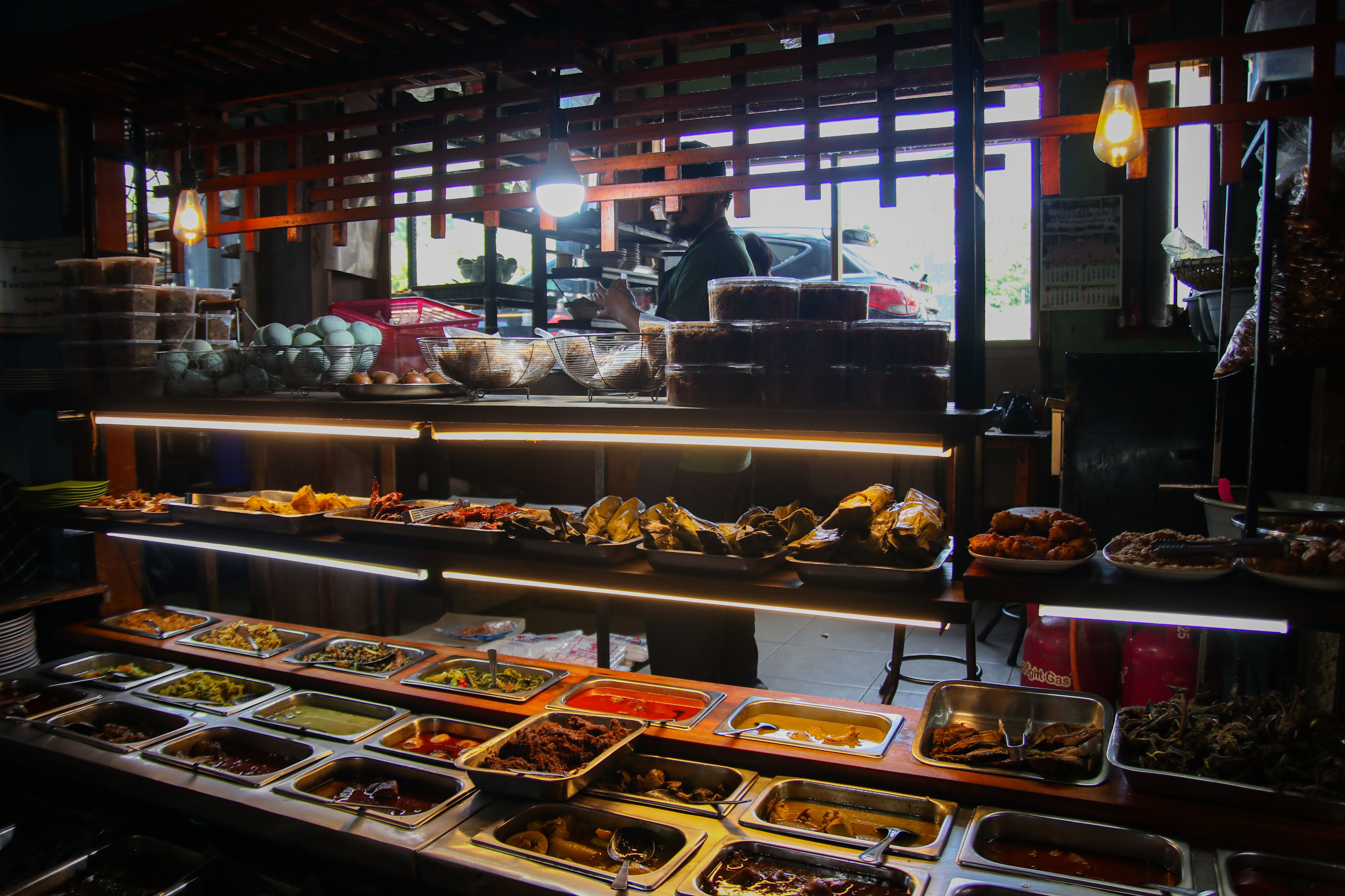 Local Balinese food market with traditional dishes and fresh produce