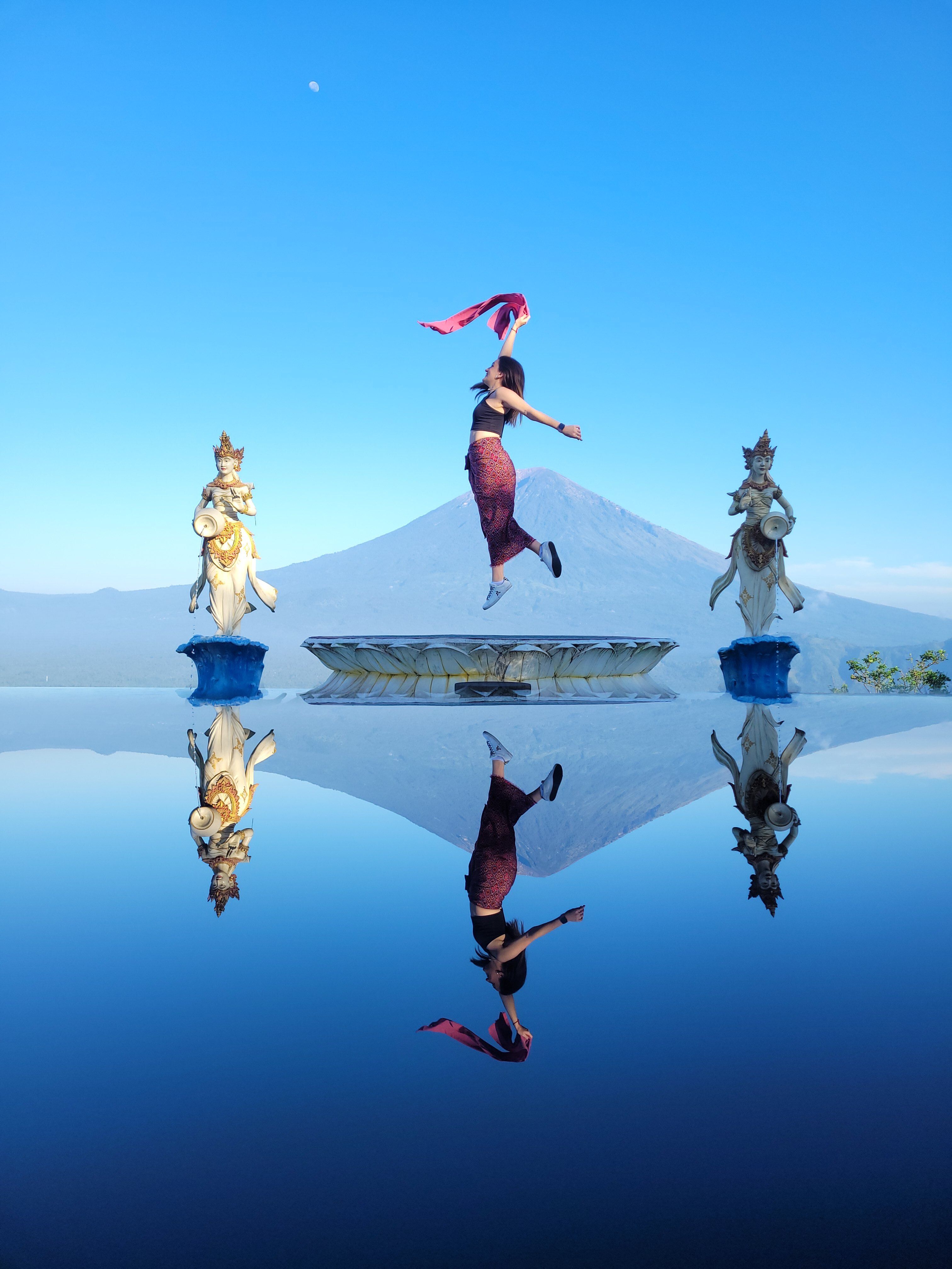 Lush green mountains and waterfalls in North Bali's highland region